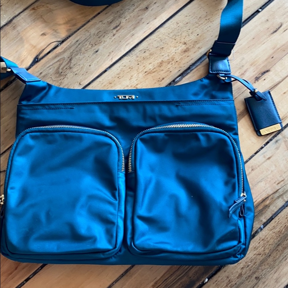 Turquoise Tumi cross body bag